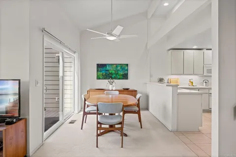 a view of a dining room with furniture and a window