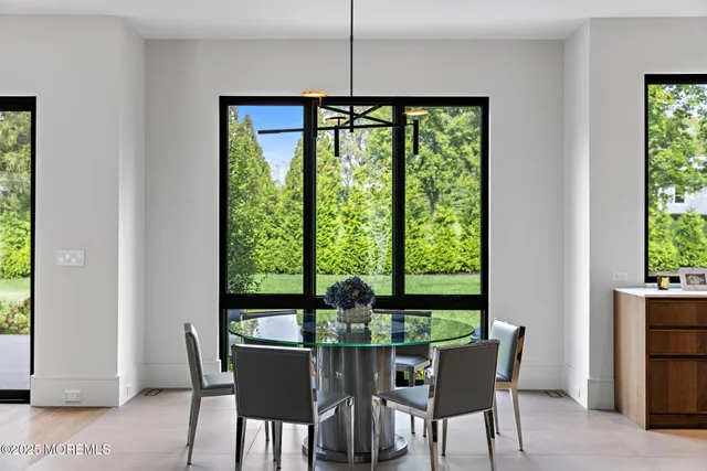 a bathroom with a sink mirror vanity and toilet