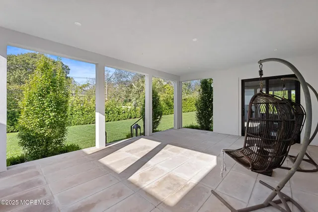 a bathroom with a glass shower door