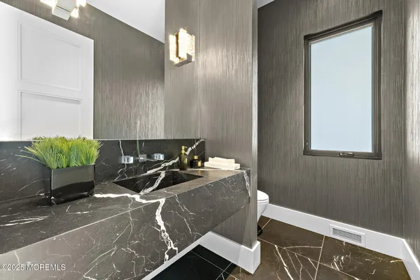 an aerial view of a house with outdoor space and street view