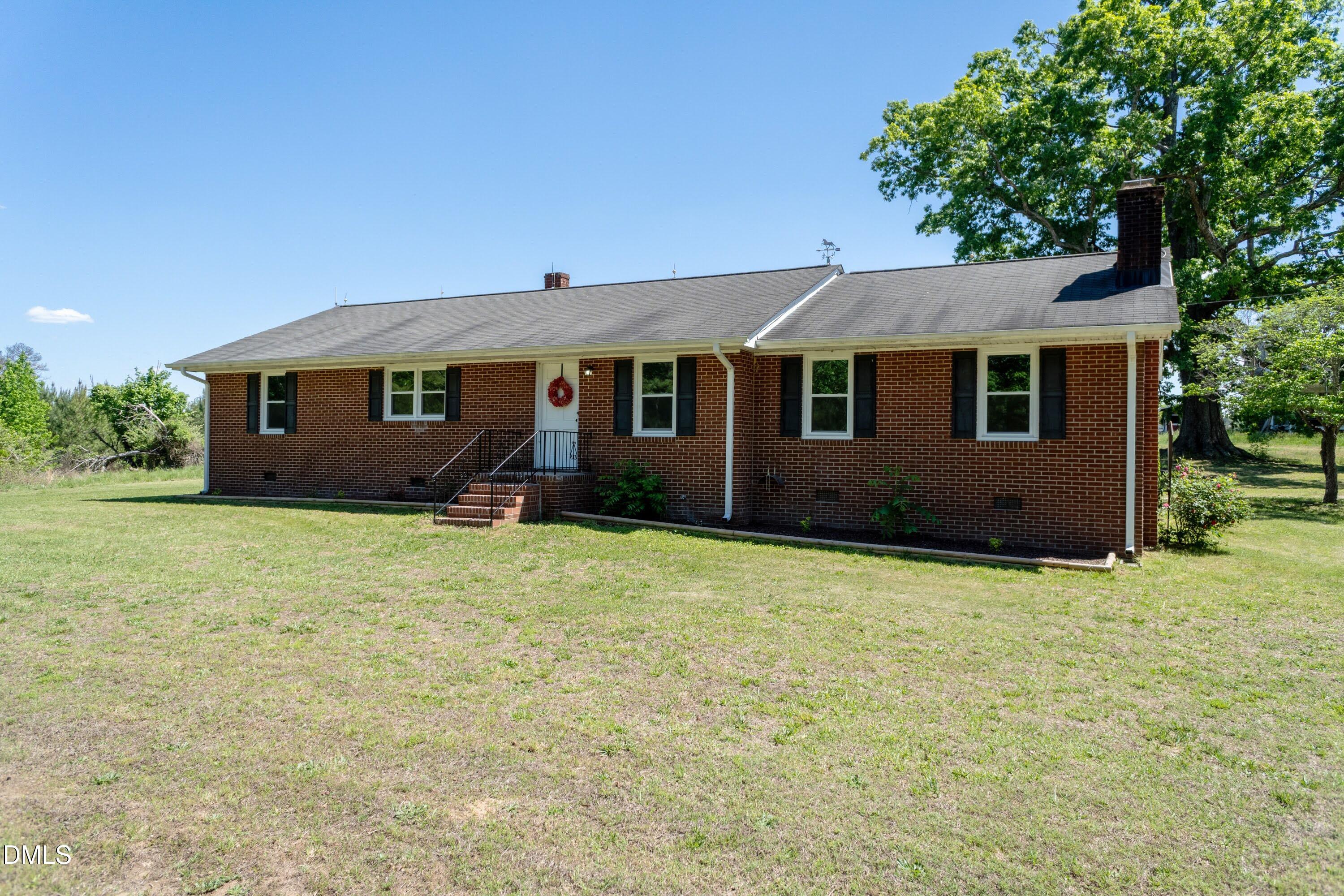 641 Rocky Ford Road Louisburg, NC 27549 - Photo 3 of 38 a house view with a garden space