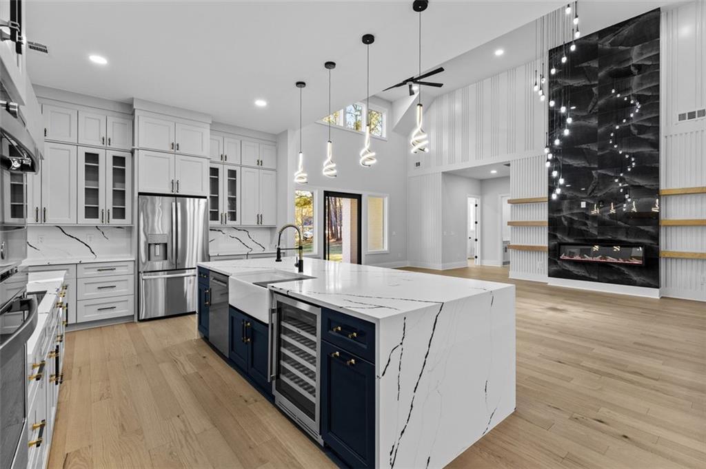 1198 Peters Cemetary Road Monroe, GA 30655 - Photo 13 of 64 a kitchen with stainless steel appliances kitchen island a refrigerator and a stove