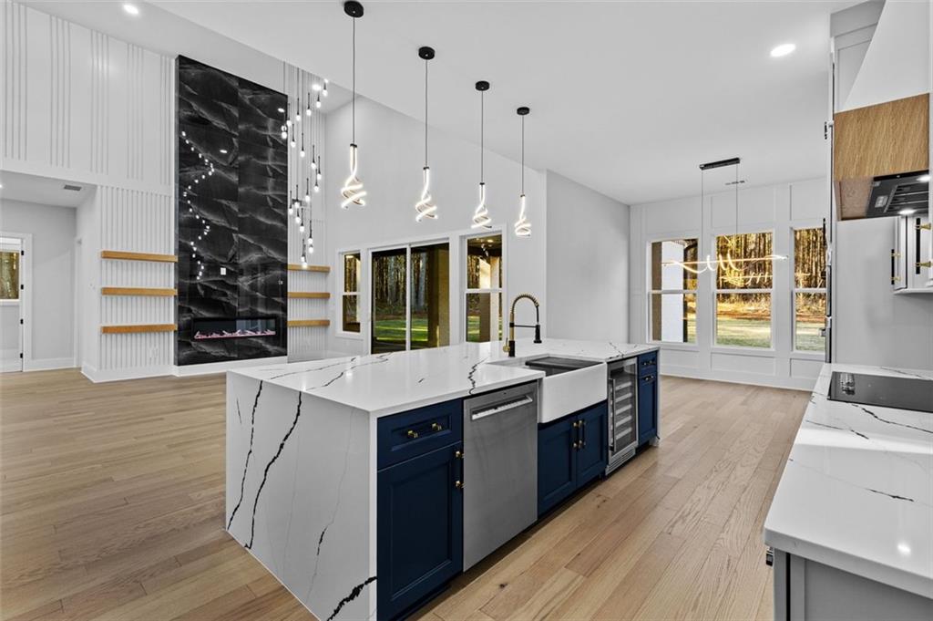 1198 Peters Cemetary Road Monroe, GA 30655 - Photo 14 of 64 a kitchen with granite countertop a sink a counter top space and stainless steel appliances