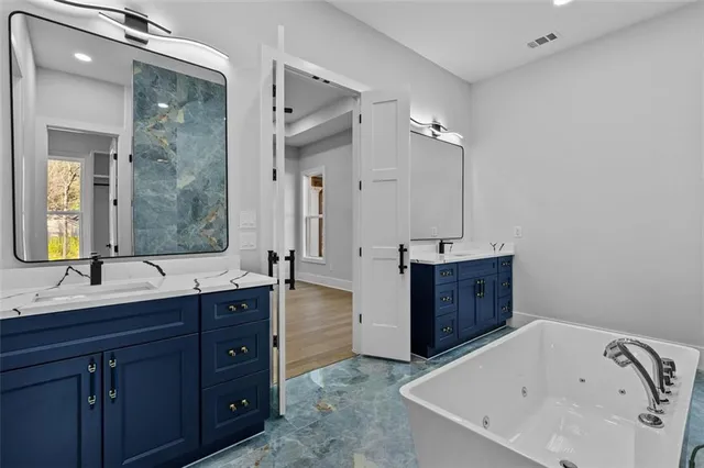 an empty room with a window and a ceiling fan