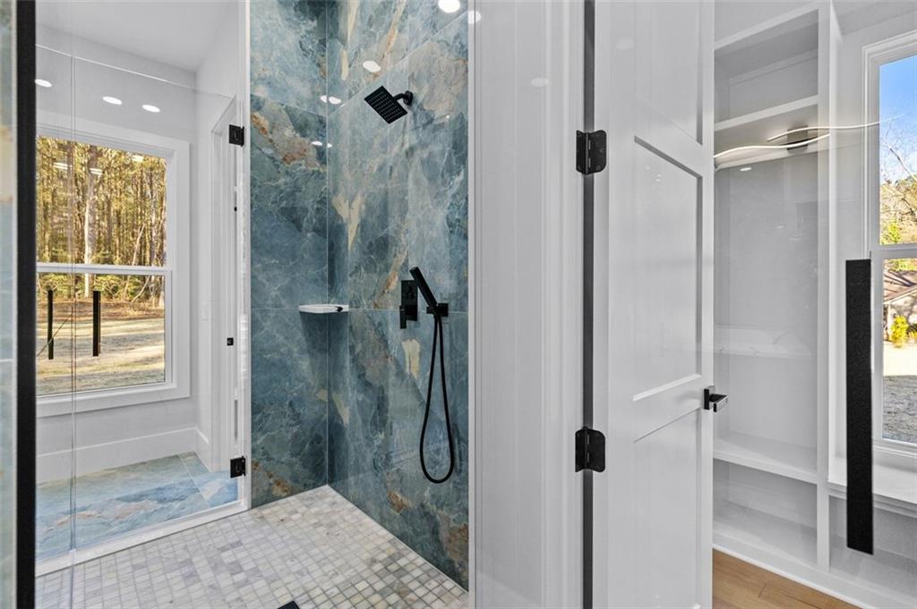 1198 Peters Cemetary Road Monroe, GA 30655 - Photo 29 of 64 a bathroom with a shower and a sink