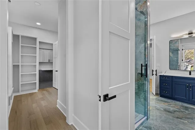 a bathroom with a bathtub and shower