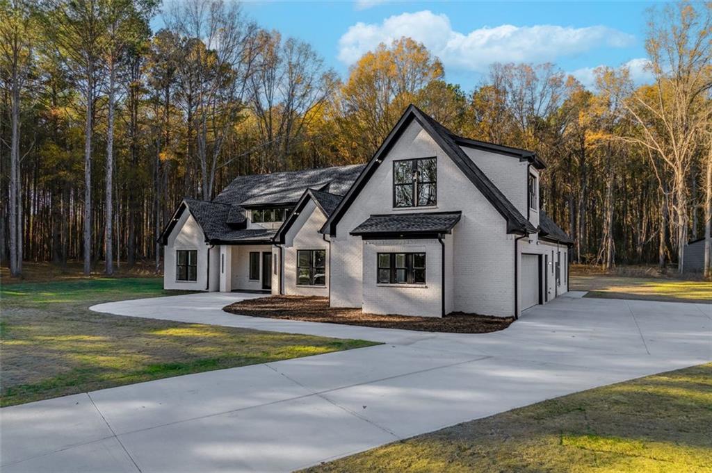 1198 Peters Cemetary Road Monroe, GA 30655 - Photo 4 of 64 a front view of a house with yard and green space