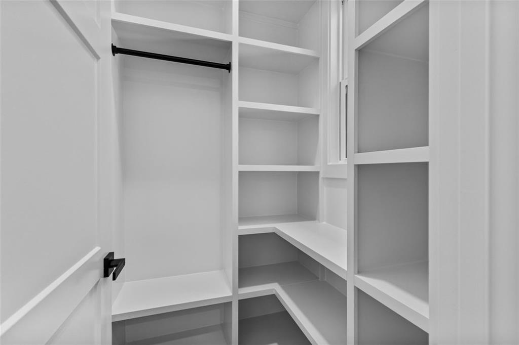 1198 Peters Cemetary Road Monroe, GA 30655 - Photo 42 of 64 a view of walk in closet with empty racks