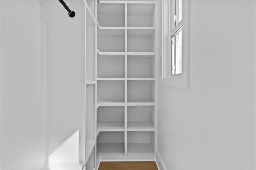 1198 Peters Cemetary Road Monroe, GA 30655 - Photo 45 of 64 a room with walk in closet with empty racks