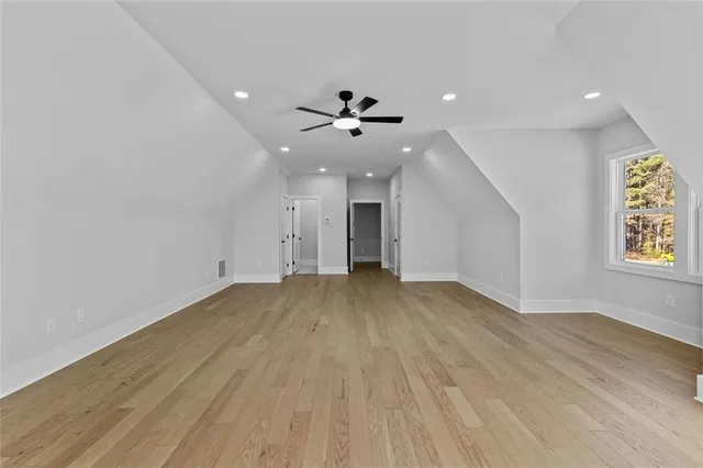 a front view of house with yard and trees around