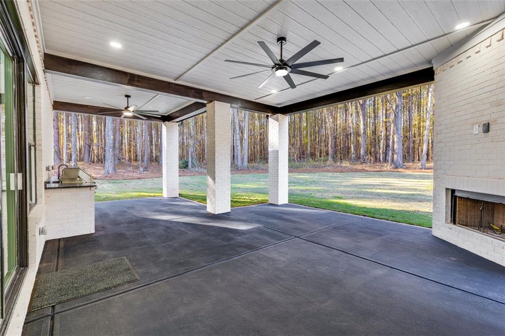 1198 Peters Cemetary Road Monroe, GA 30655 - Photo 55 of 64 a view of an empty room with a fireplace and a window