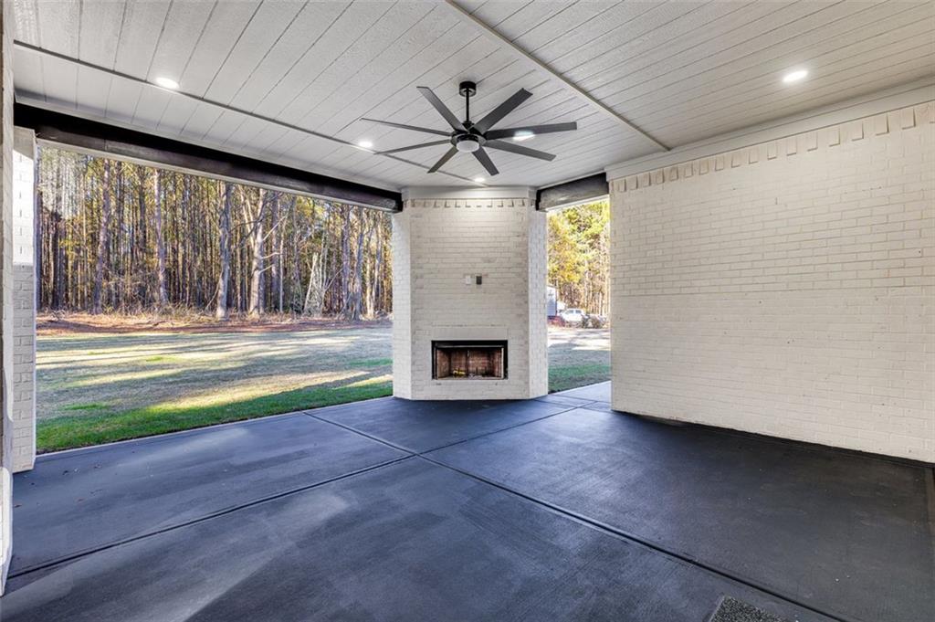 1198 Peters Cemetary Road Monroe, GA 30655 - Photo 56 of 64 a view of an empty room with a fireplace and a window