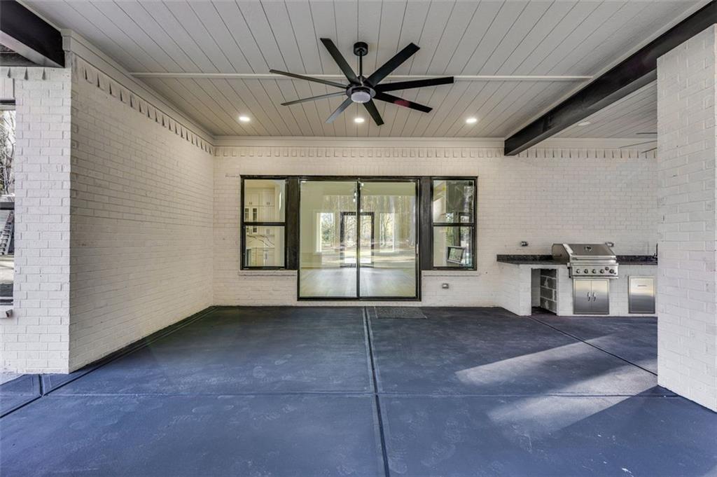 1198 Peters Cemetary Road Monroe, GA 30655 - Photo 57 of 64 a view of an empty room with window and a kitchen