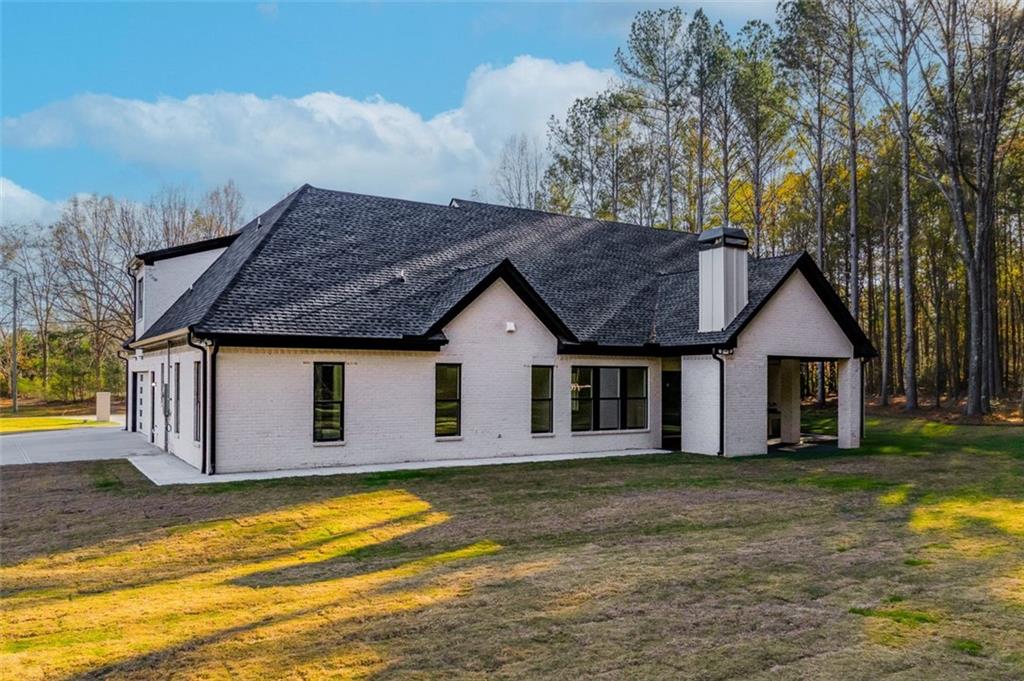 1198 Peters Cemetary Road Monroe, GA 30655 - Photo 59 of 64 a front view of house with yard and trees around