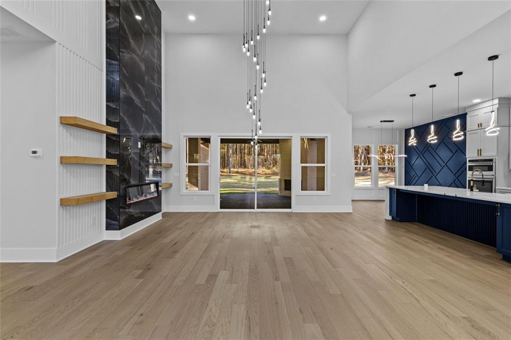 1198 Peters Cemetary Road Monroe, GA 30655 - Photo 6 of 64 a view of an empty room with window and cabinet