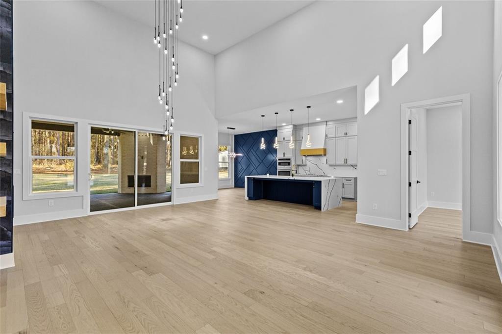 1198 Peters Cemetary Road Monroe, GA 30655 - Photo 7 of 64 a large kitchen with cabinets and a kitchen