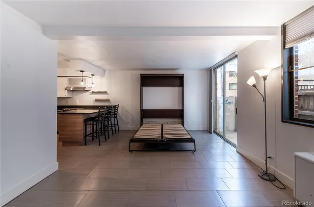 a kitchen with stainless steel appliances a refrigerator and a stove