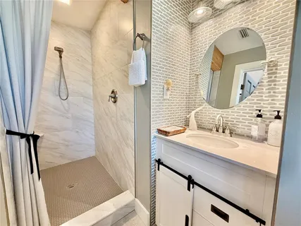 a dining room with furniture window and wooden floor