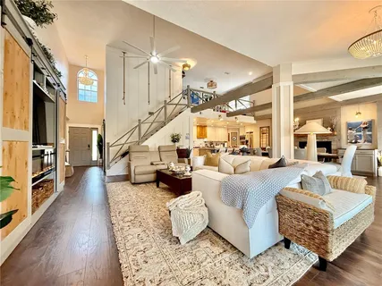 a kitchen with stainless steel appliances granite countertop a sink a stove and cabinets