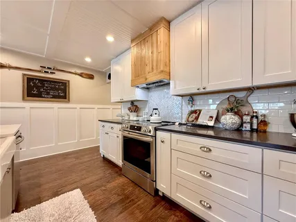 a view of a swimming pool with a patio and a garden