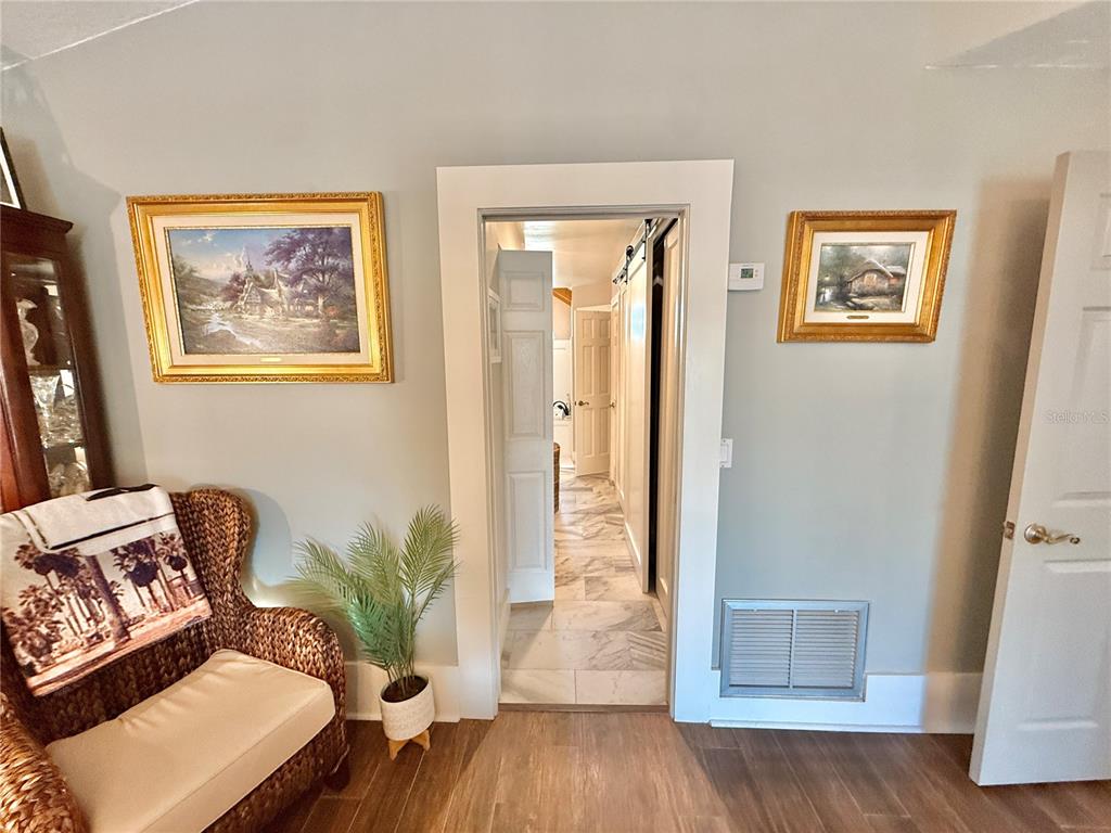 17 Coleridge Court Palm Coast, FL 32137 - Photo 41 of 96 a living room with furniture and wooden floor