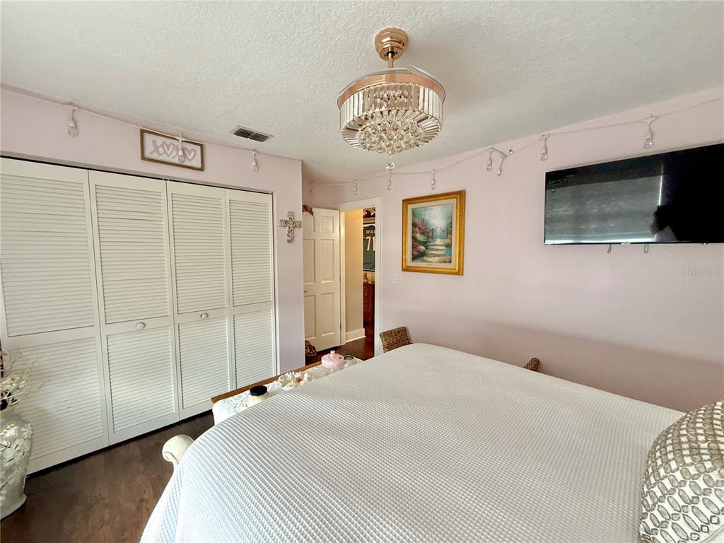 17 Coleridge Court Palm Coast, FL 32137 - Photo 74 of 96 a bedroom with a bed and a television