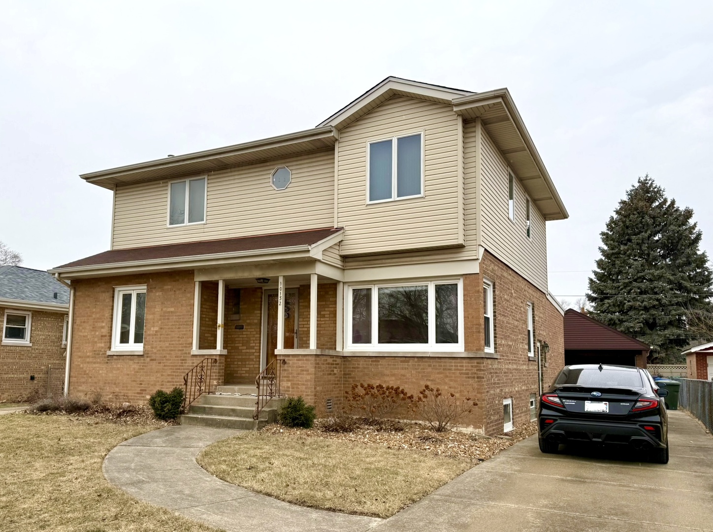 a car parked in front of a house