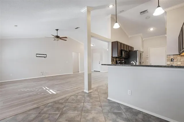a view of a kitchen with a dishwasher and a refrigerator