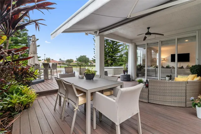 a view of a patio with a table and chairs