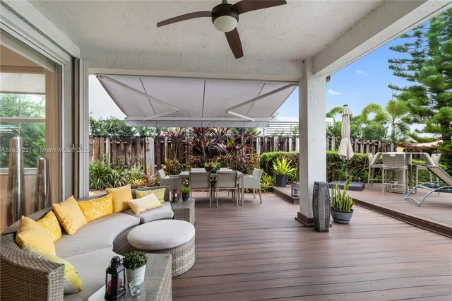 a view of a livingroom with furniture and windows