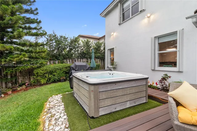 a bathroom with a sink vanity mirror and toilet