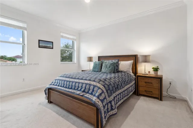 a bedroom with a bed couch and window