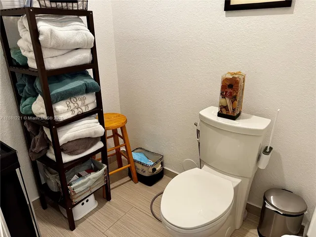 a spacious bathroom with a double vanity sink a mirror and a bathtub