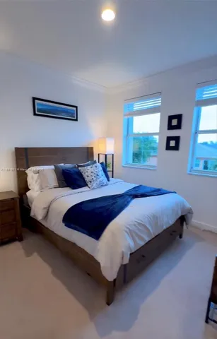 a bathroom with a double vanity sink a mirror and shower