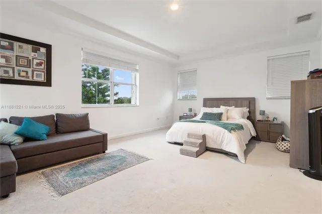 an aerial view of a house with a lake view