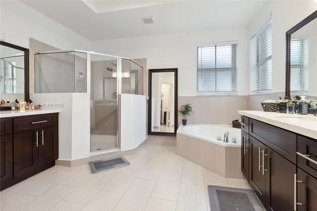 an aerial view of a house with a lake view