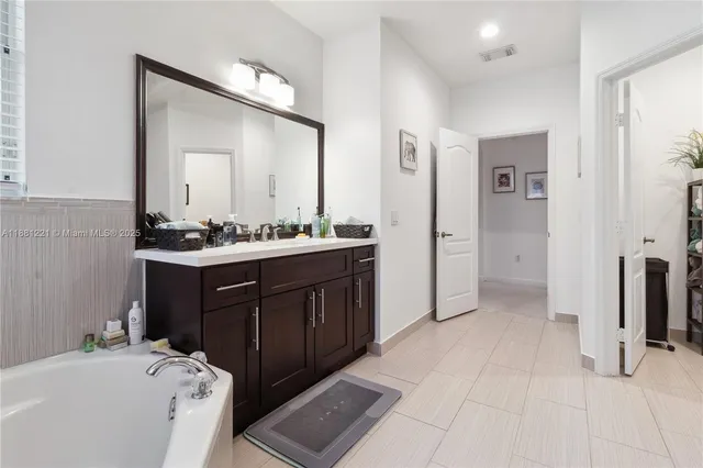 an aerial view of multiple houses with outdoor space