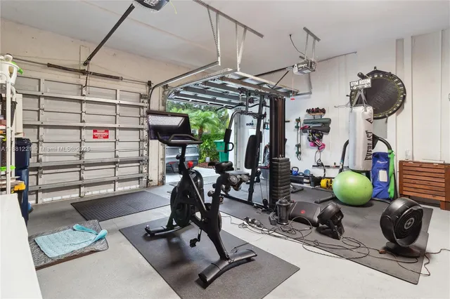 an aerial view of a house with a yard and potted plants