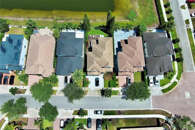 an aerial view of residential houses with outdoor space