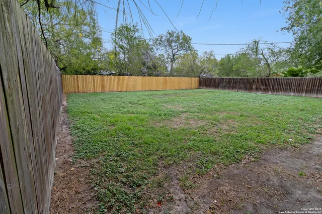 a backyard of a house with lots of green space