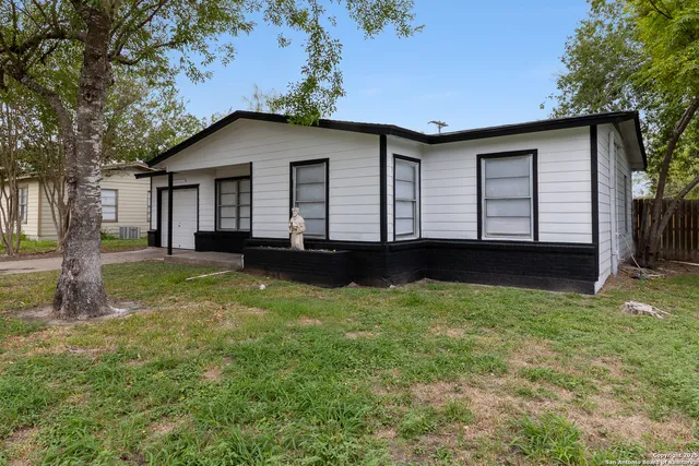 a house view with a garden space