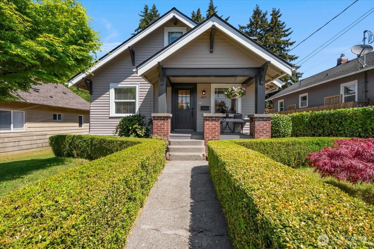 4837 South I Street Tacoma, WA 98408 - Photo 1 of 40 a view of a house with sitting area and garden