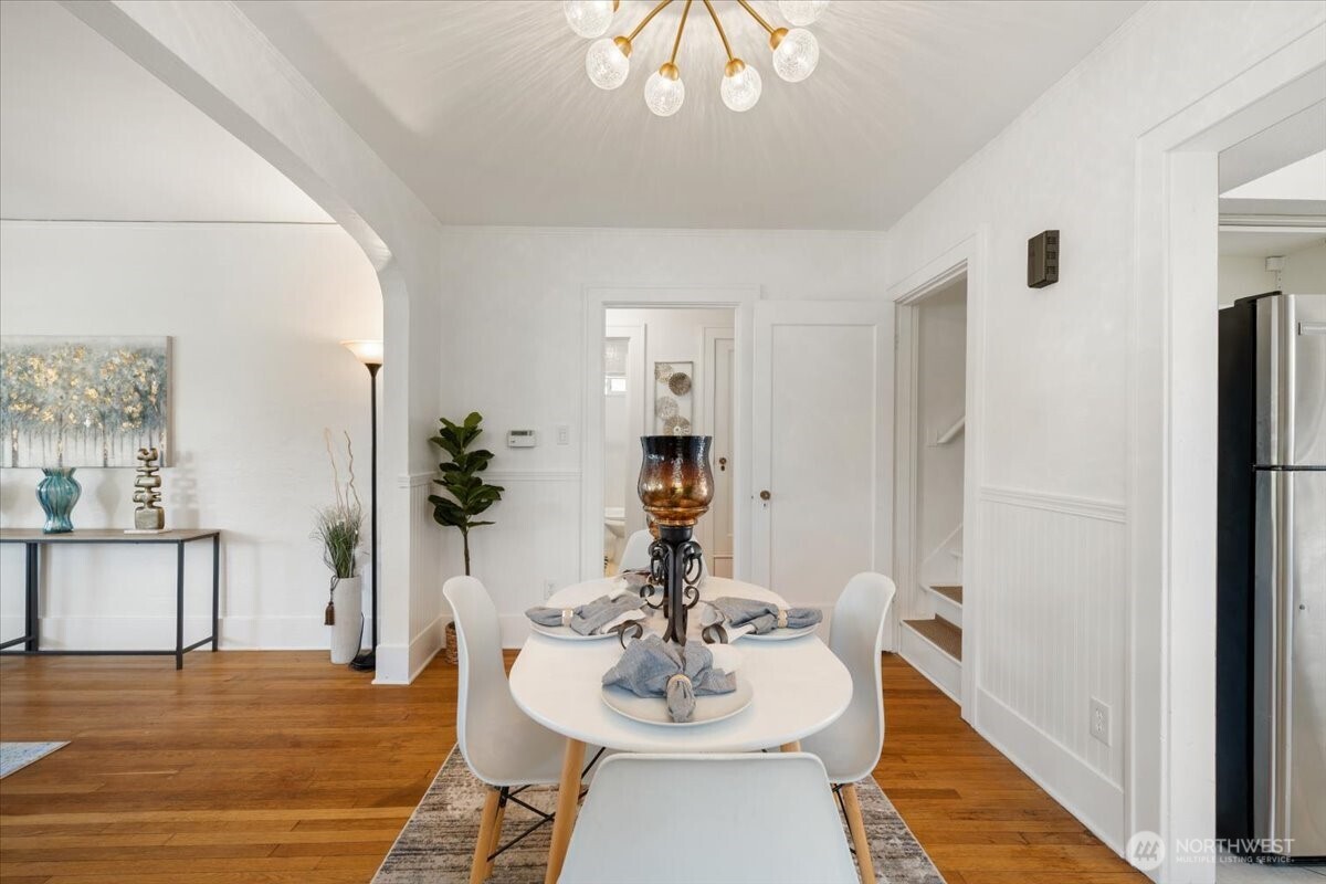 4837 South I Street Tacoma, WA 98408 - Photo 11 of 40 a view of a dining room with furniture and wooden floor