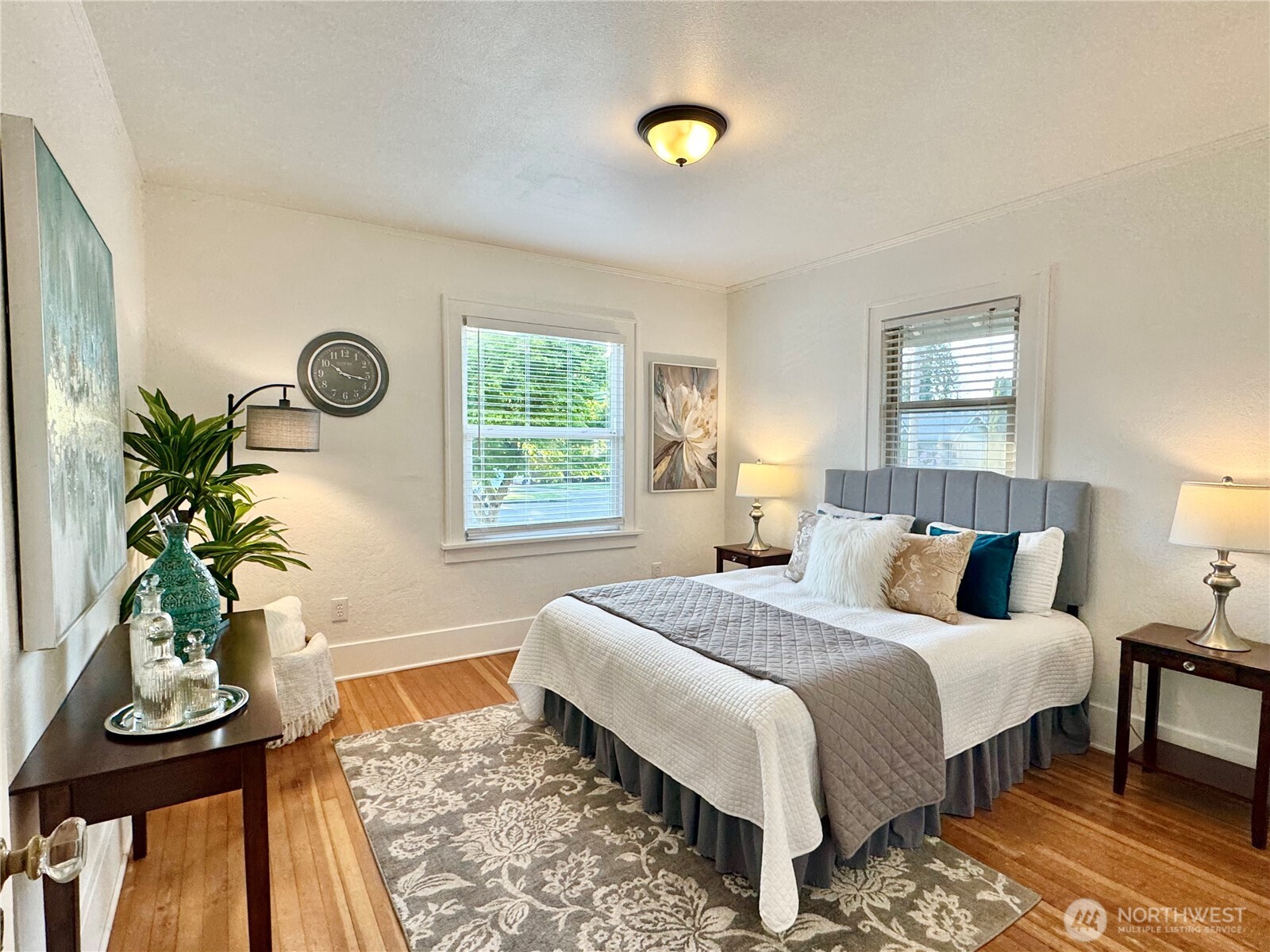 4837 South I Street Tacoma, WA 98408 - Photo 13 of 40 a bedroom with a bed and a table