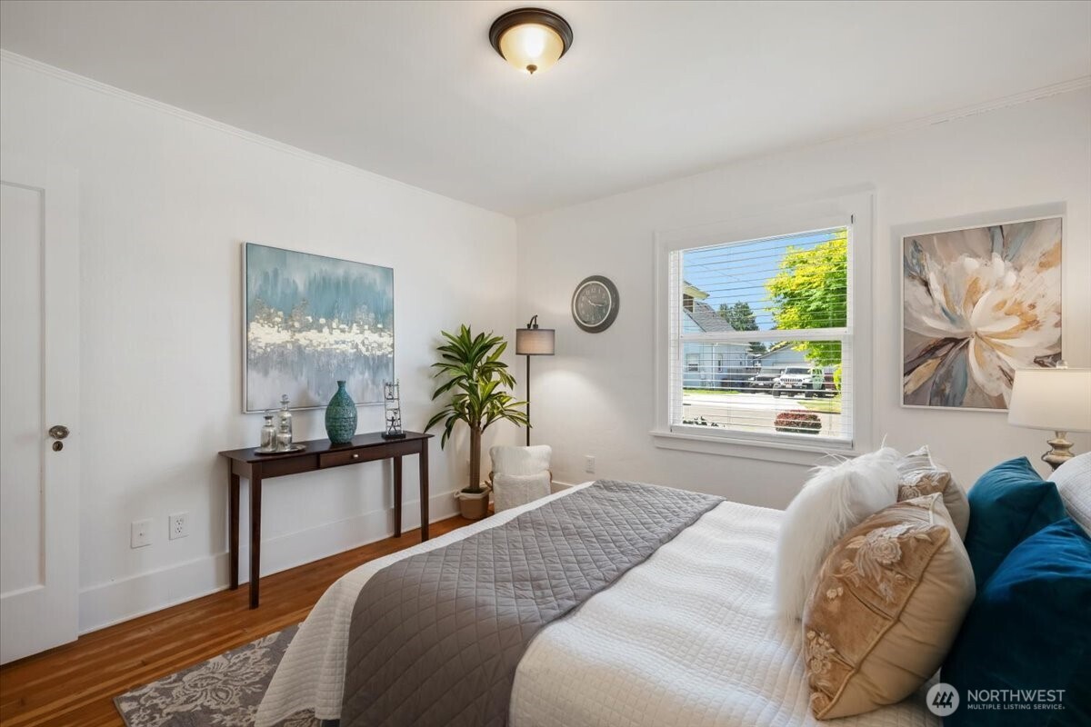 4837 South I Street Tacoma, WA 98408 - Photo 14 of 40 a bedroom with a bed and a window