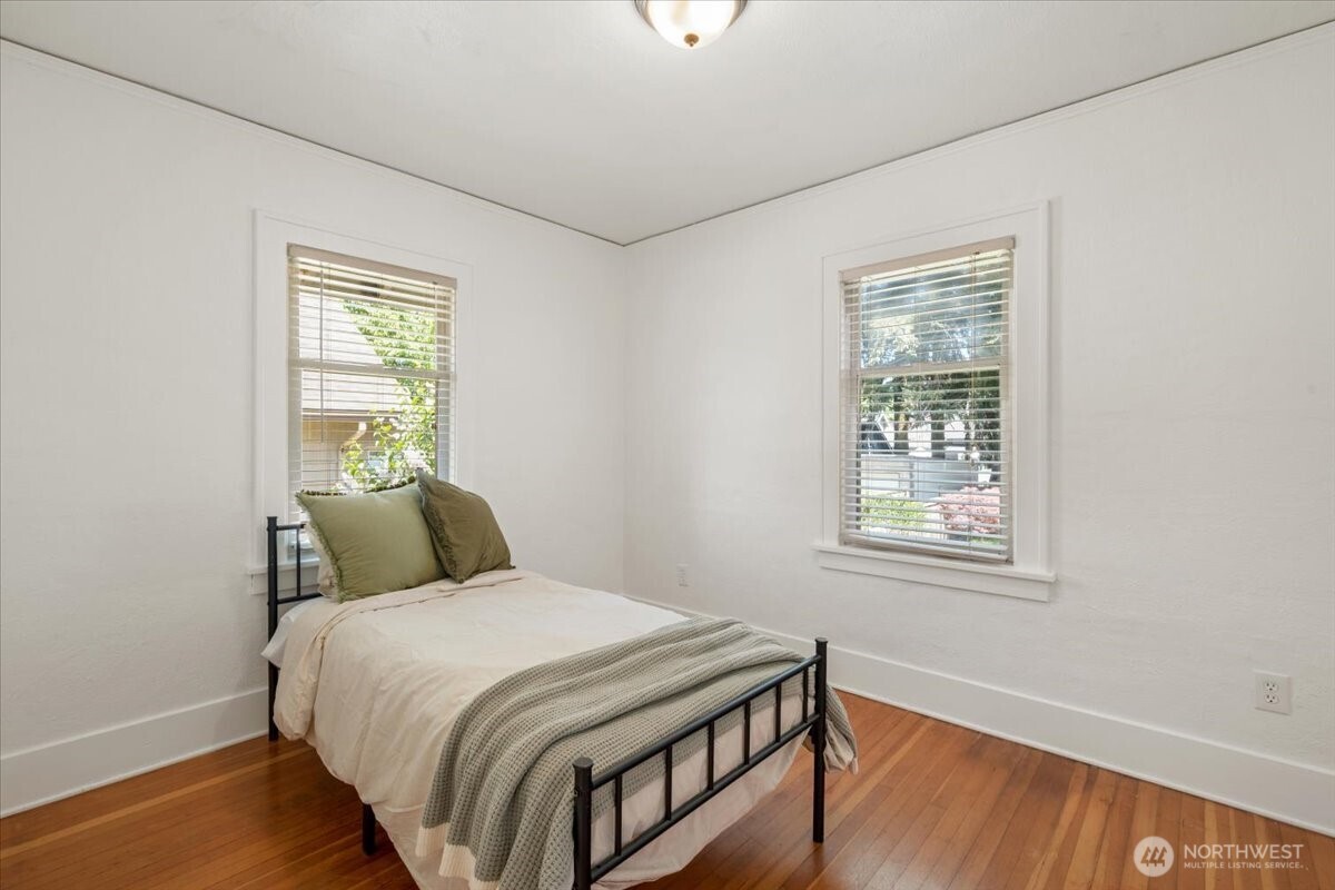 4837 South I Street Tacoma, WA 98408 - Photo 18 of 40 a bedroom with a bed and a window