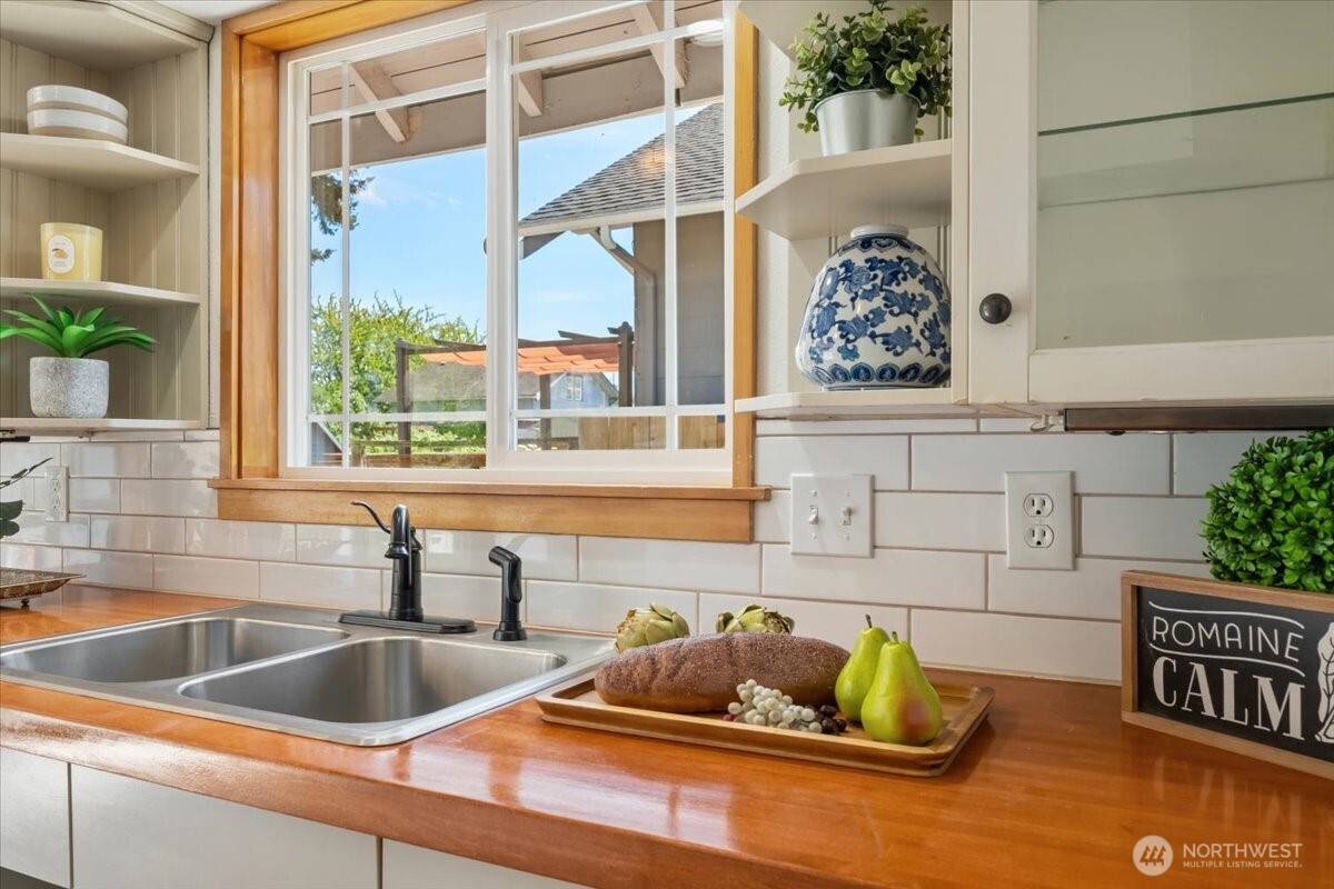 4837 South I Street Tacoma, WA 98408 - Photo 21 of 40 a kitchen with a sink and a wooden floor