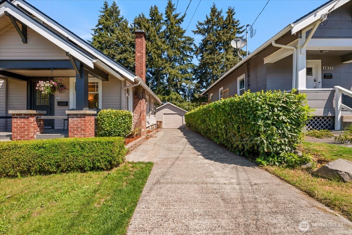 4837 South I Street Tacoma, WA 98408 - Photo 36 of 40 a front view of a house with garden