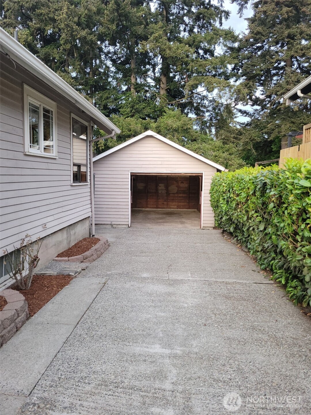 4837 South I Street Tacoma, WA 98408 - Photo 37 of 40 a white house that has a tree in front of it