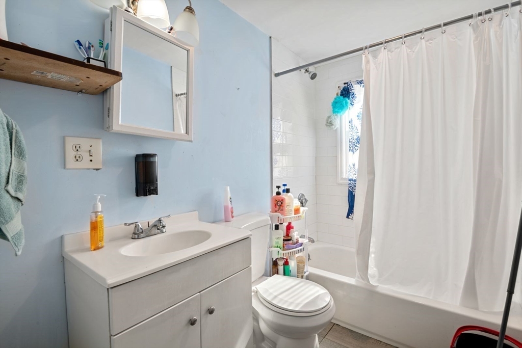 48 Hardwick Terrace Boston, MA 02135 - Photo 12 of 32 a bathroom with a sink toilet and shower